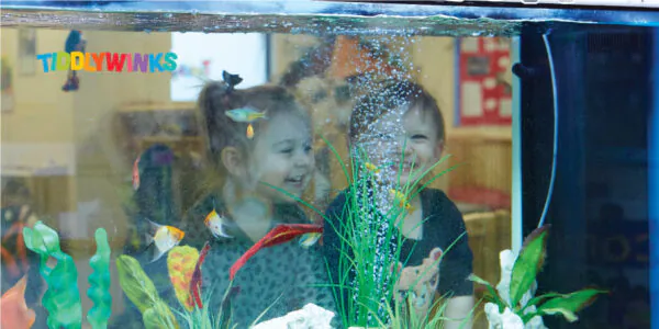 Kids Looking at Fish Tank