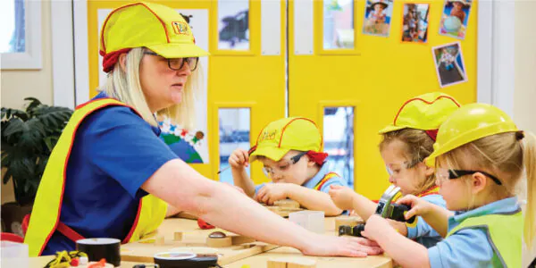 Team Member and Children Playing Construction